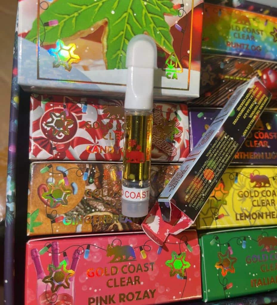 Gold Coast Clear Carts authentic 510 vape cartridges unboxed with retail packaging display
