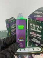 Whole Melt v6 authentic live diamond disposable vape pen unboxed with retail packaging display